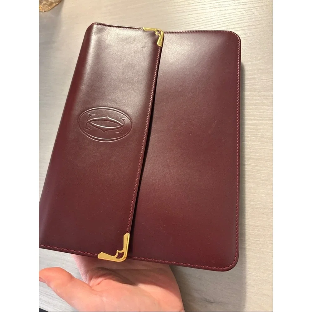 Cartier Burgundy Leather wristlet with Gold Corners